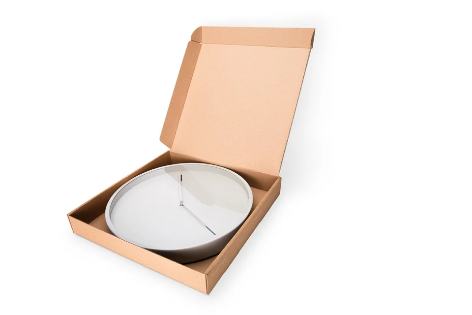 Boring Clock in its cardboard box